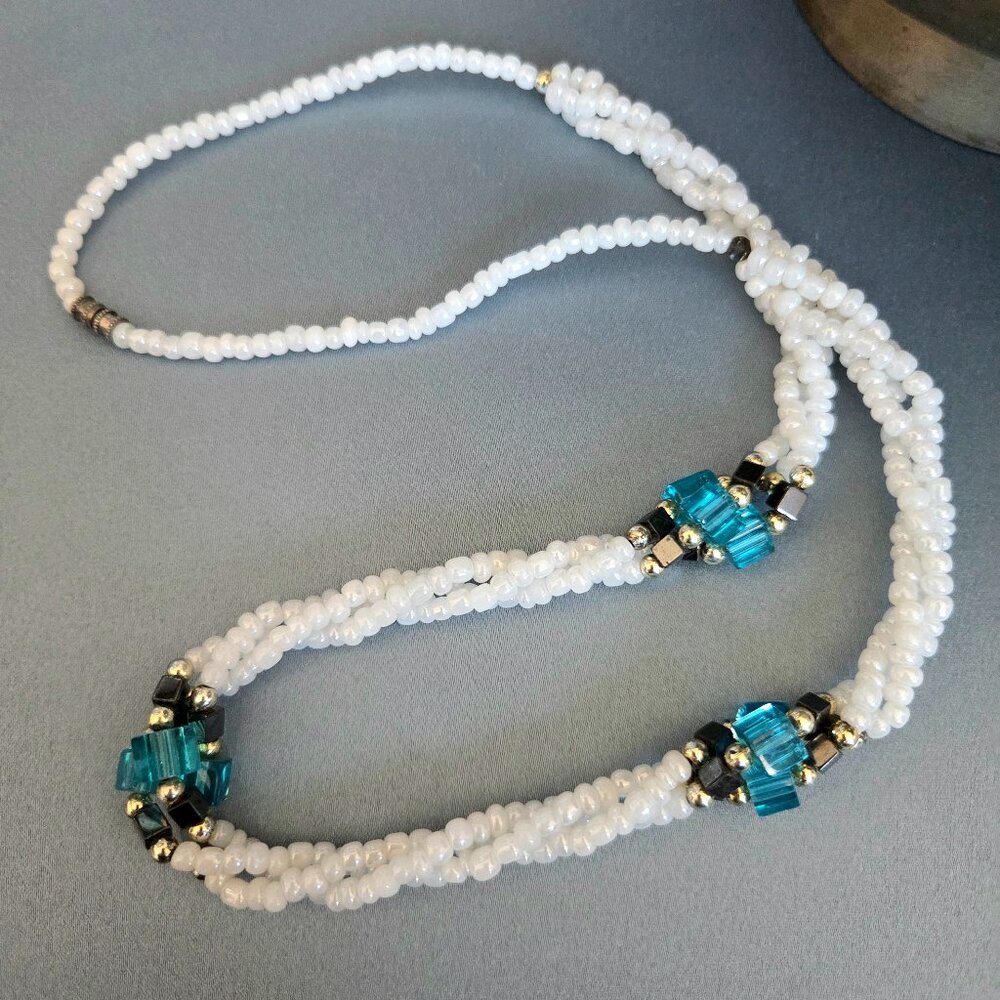 Vintage beaded necklace with blue glass and Hematite details.